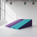 Large purple and teal gymnastics incline wedge mat in bright studio